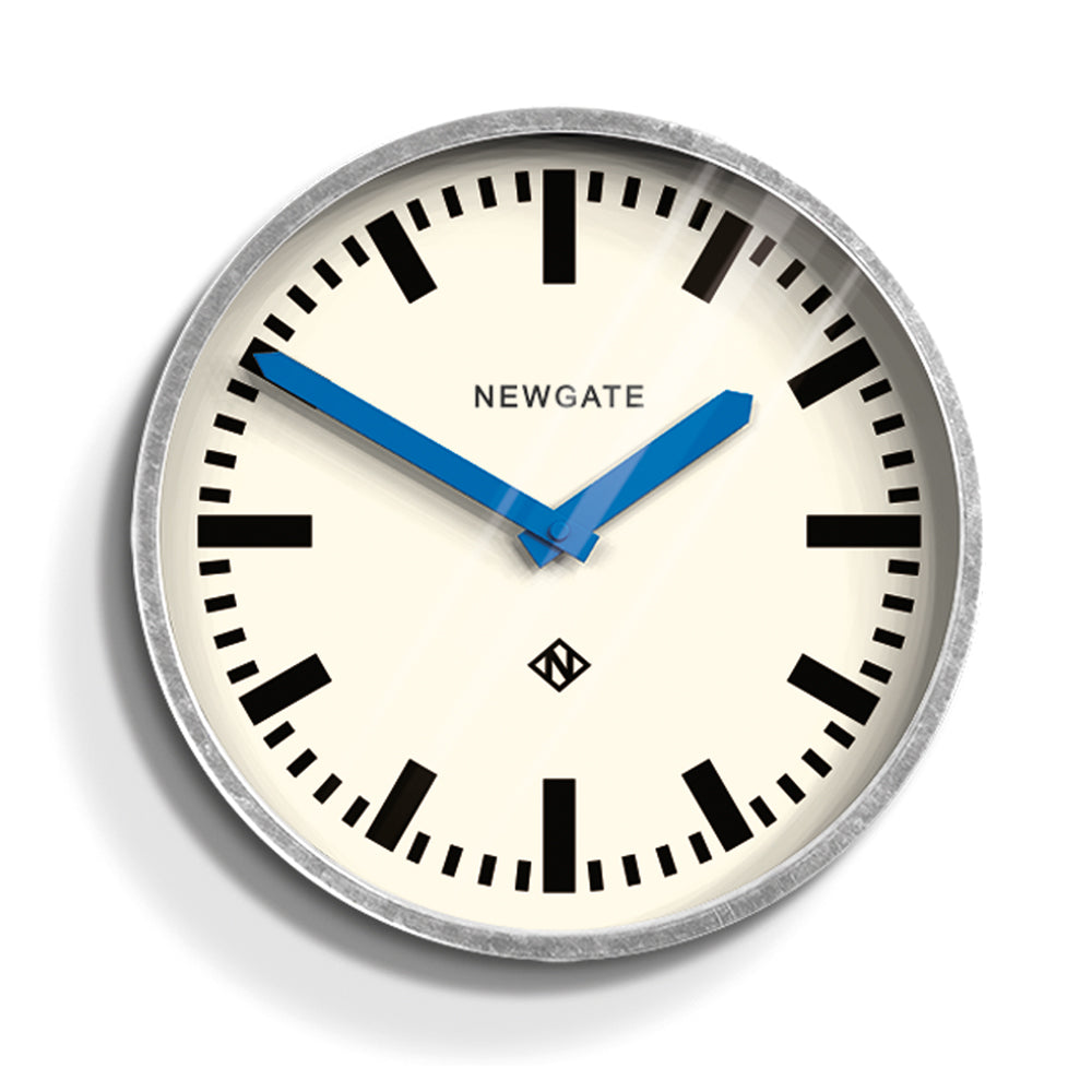 V398-NGLUGG667GALBL-202503061805-00 Newgate Luggage Wall Clock Galvanised Blue Hands - Image 1