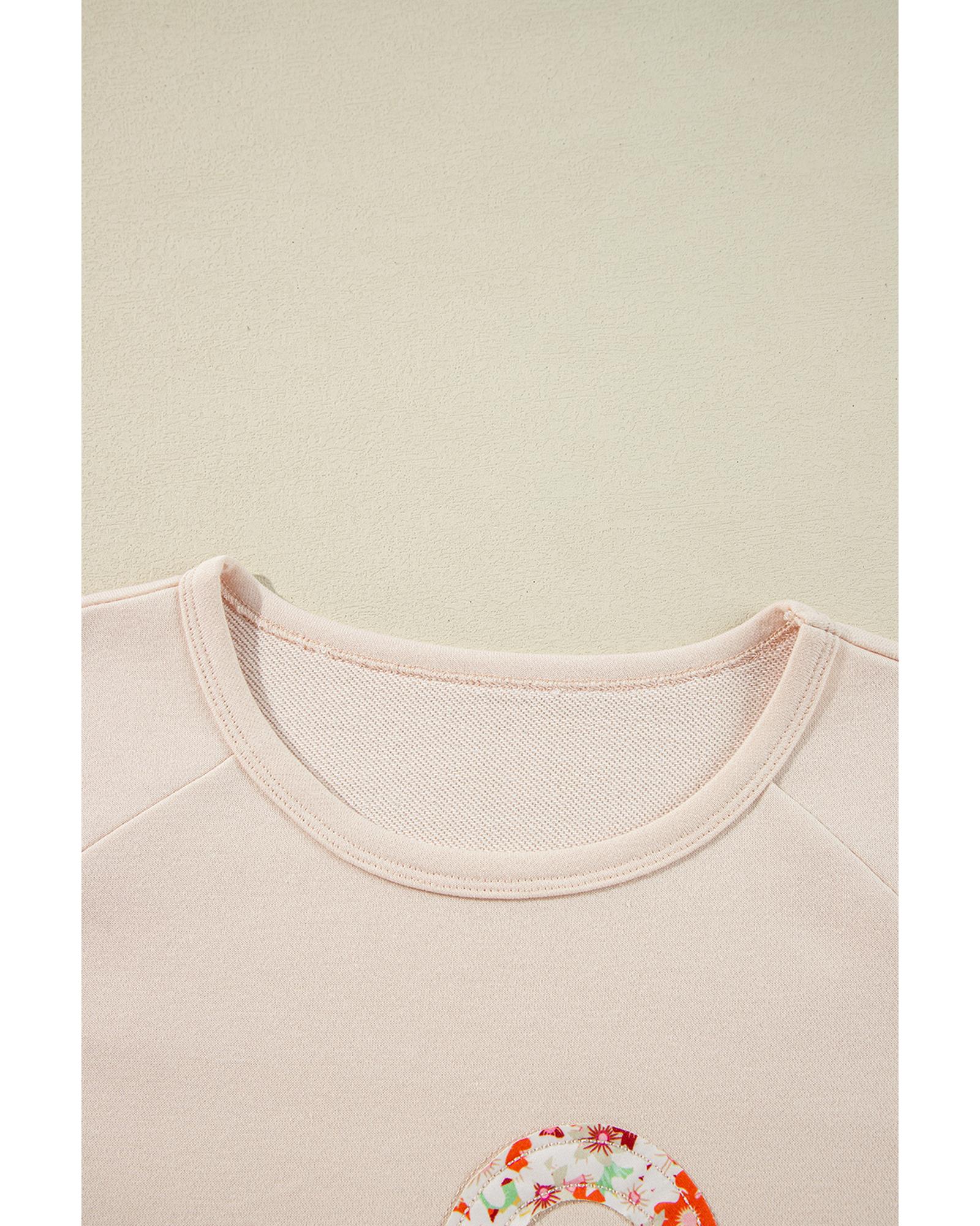 V539-AZEXDC25129068-P15-M-202508271406-00 Beige Flower Patch Graphic Exposed Seam Wide Sleeve Top - M - Image 1