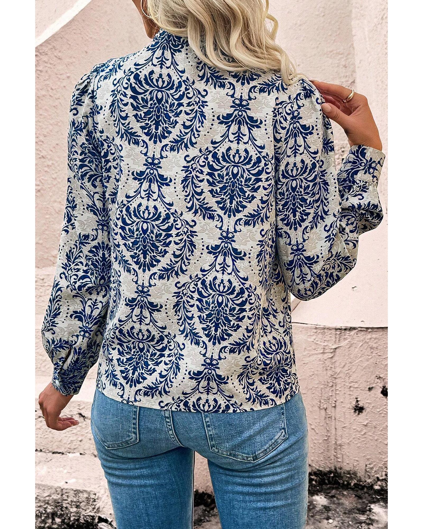 V539-AZEXPL2555343-P420-1X-202506152036-00 Sky Blue Tribal Pattern Print Notch Neck Buttoned Plus Size Shirt - 1X - Image 1