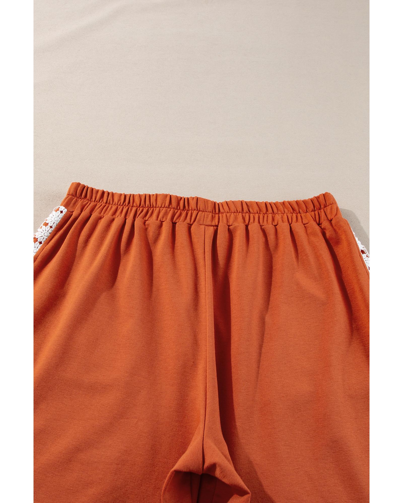 V539-AZEXPL771383-P5014-1X-202506152333-00 Azura Exchange Gold Flame Plus Size Floral Crochet Patch Drawstring Wide Leg Pants - 1X - Image 1