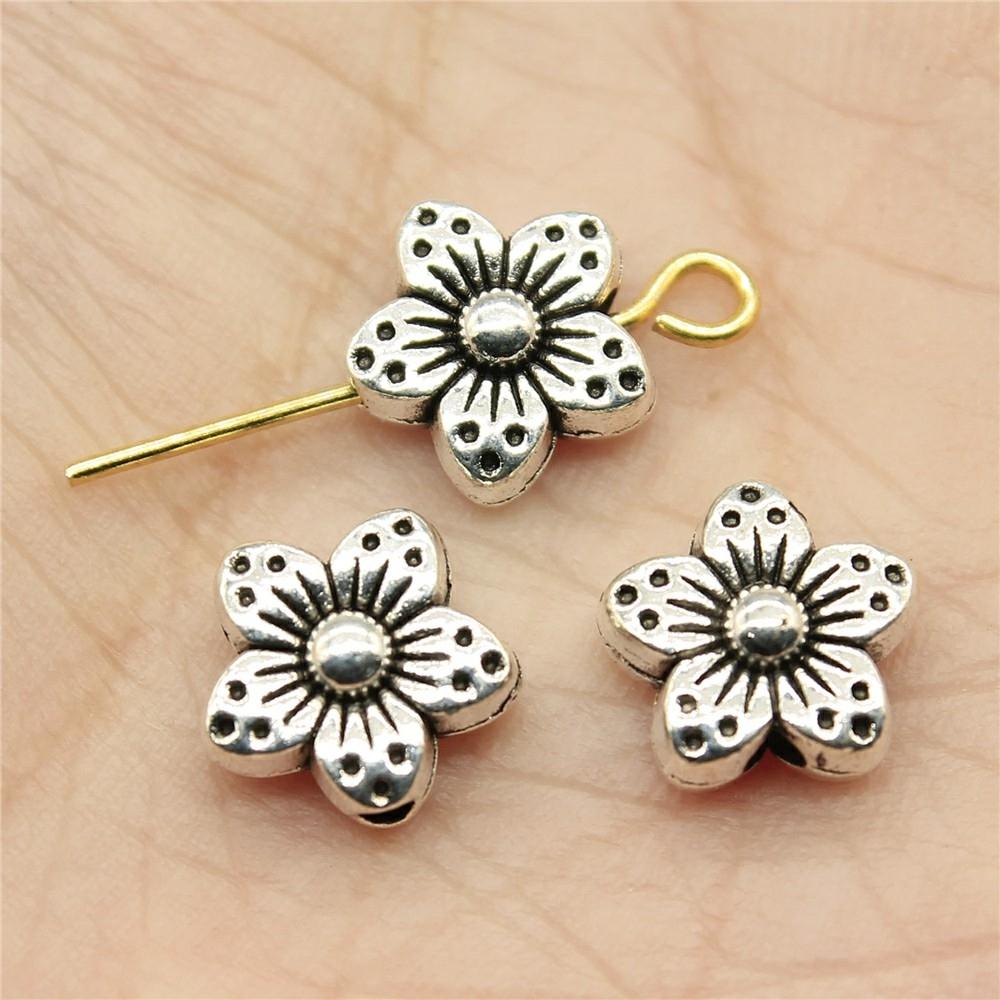 V562-42501310DBT-202504112025-00 30 Tibetan Flower Charms 9X9X5Mm Beads For Jewelry Making - Image 1
