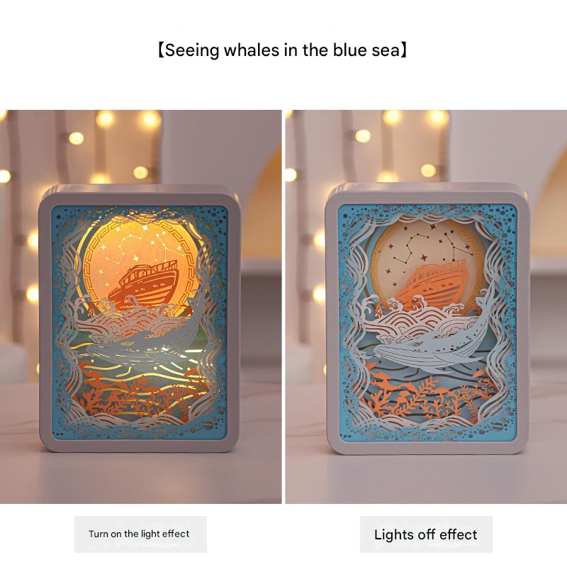 V888-ELOSUNG13587-212239-00 Whale Watching In The Blue Sea 3D Paper Carving Night Light - USB Or Battery Powered Decorative Bedside Lamp | Atmosphere Lamp for Bedroom | Creative Starry Night and Little Prince Design Gift - Image 1