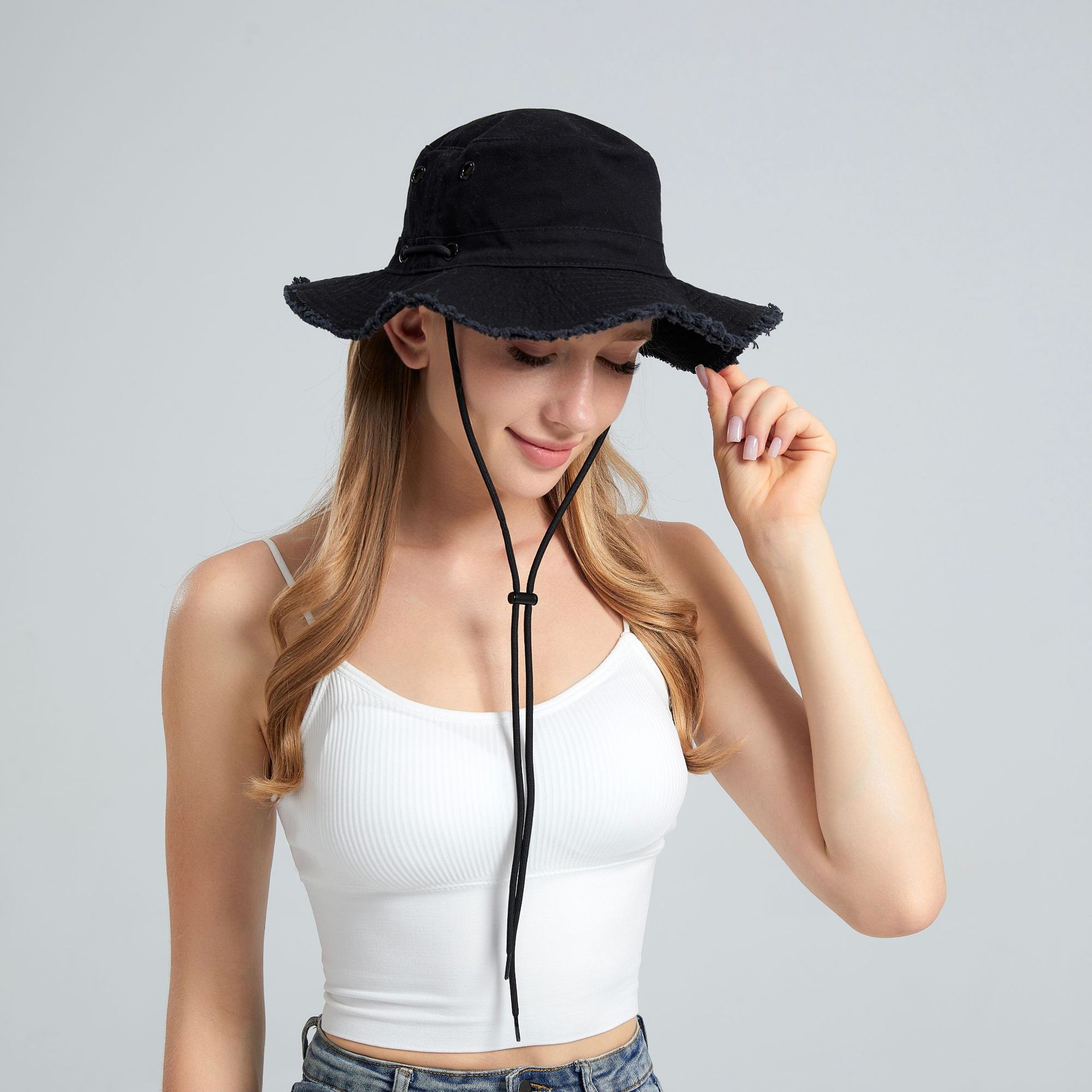 V888-ELOSUNG23653-202504141706-00 Black Packable Cotton Bucket Hat - Folds into Wearable Pouch | Frayed Edge Sun Hat with Chin Strap - Image 1