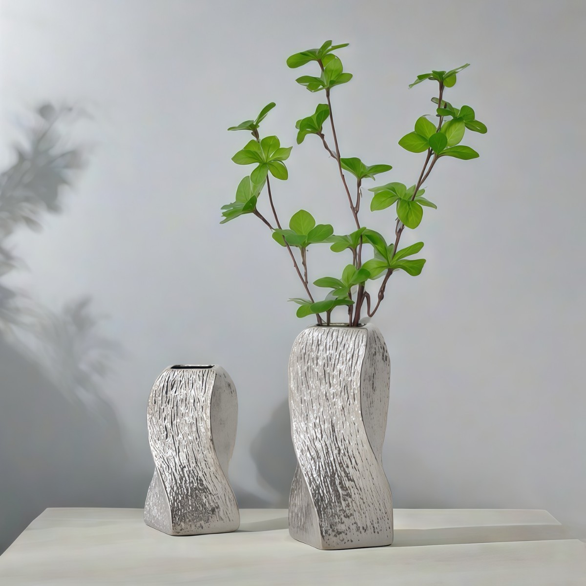 V888-ELOSUNG26190-202504171640-00 Silver Abstract Twisted Ceramic Vase - Artistic Minimalist Flower Holder for Home Decor (20x10x10cm) - Image 1