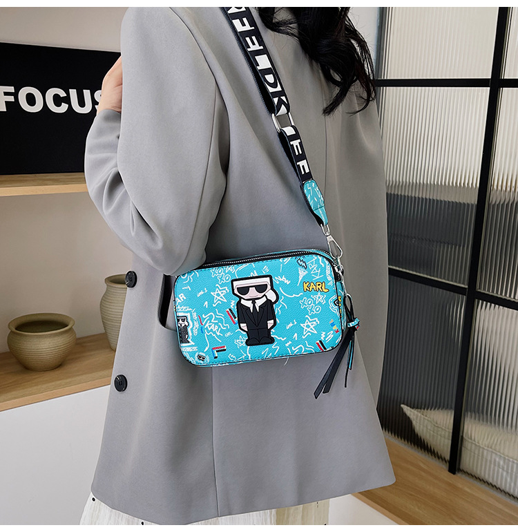 V888-ELOSUNG26777-202505131932-00 Blue Unique Doodle Print PU Leather Bag - Lightweight Crossbody with Character - Image 1